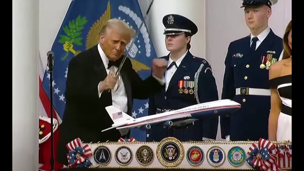 Donald Trump dances at inaugural ball with a SWORD in his hand