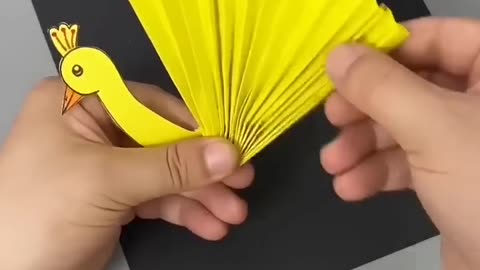 To make a paper peacock using used paper, follow these steps: