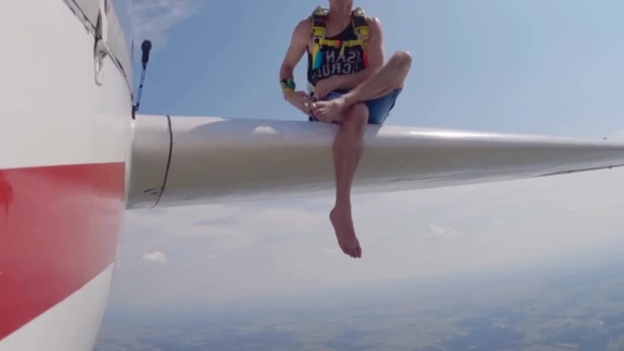 Daring Skydiver Balances on Plane Wing Before Taking the Leap #skydrive