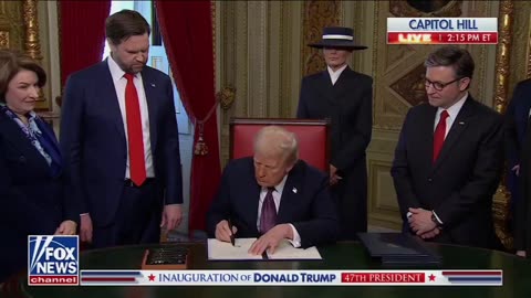 President Donald Trump signs the first executive orders of his term