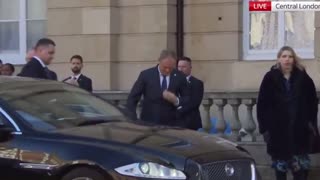 Polish Prime Minister Donald Tusk arrives at Lancaster House with a noticeable limp