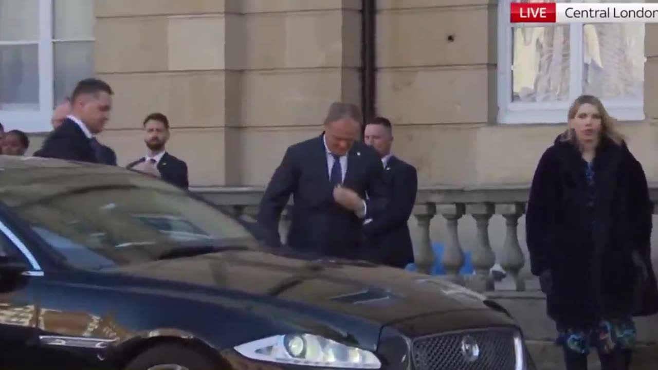 Polish Prime Minister Donald Tusk arrives at Lancaster House with a noticeable limp