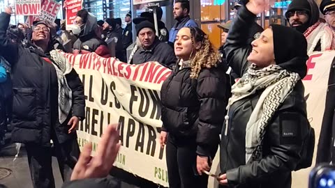 "HANDS OFF PALESTINE" protestors marching to The New York Times.