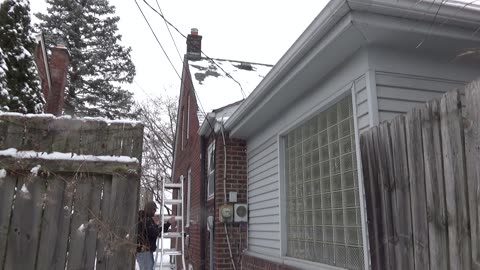 Joseph Normand Grinnell Climbs An Outdoor Ladder, Dearborn, Michigan, February 13, 2025