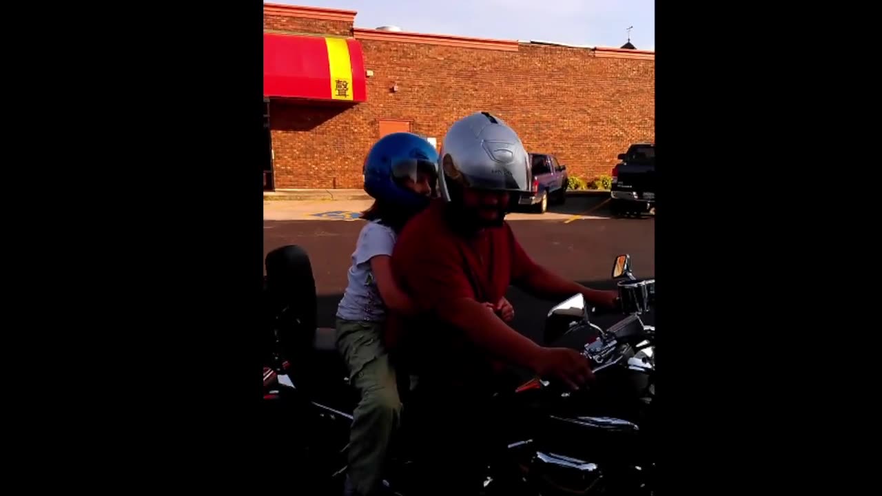 Little one first ride on the motor cycle