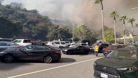 Several residences on fire from the Pacific Palisades Brush fire in California