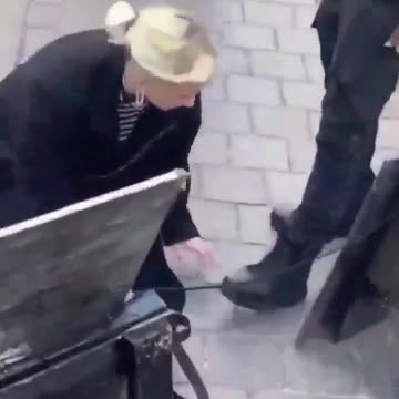 She kisses black people's feet to make amends.