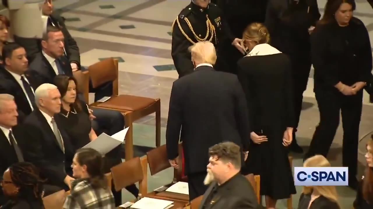 Trump and Mike Pence shake hands during Jimmy Carter's funeral