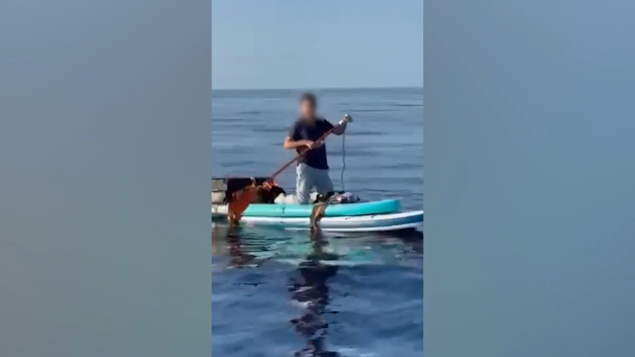 U.S. Coast Guard Intercepts Chinese Migrant On A Paddleboard Off The Bahamas