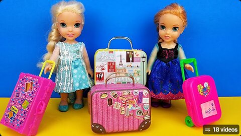 Elsa and Anna toddlers - shopping for luggage - suitcases - Barbie is the seller