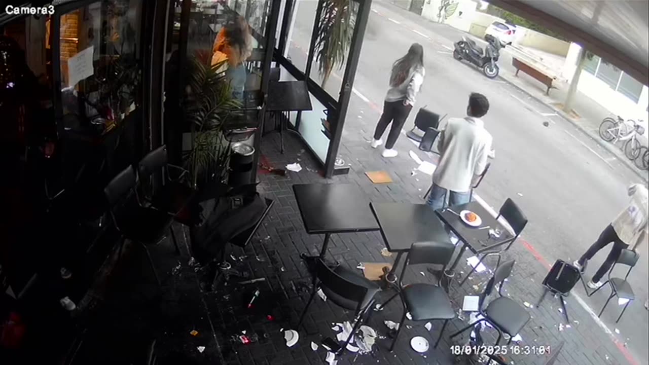 Surveillance camera footage shows the stabbing attack in Tel Aviv this afternoon