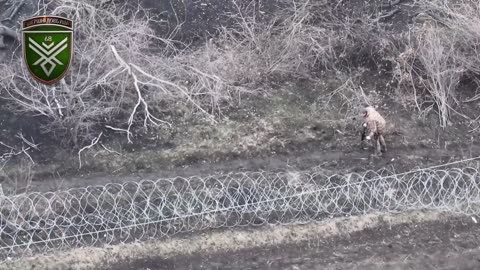 Dramatic Footage of Russians Attacking Through Multiple Lines of Razor-Wire