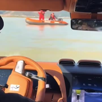 Driving a car in the river