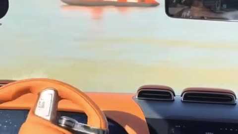 Driving a car in the river