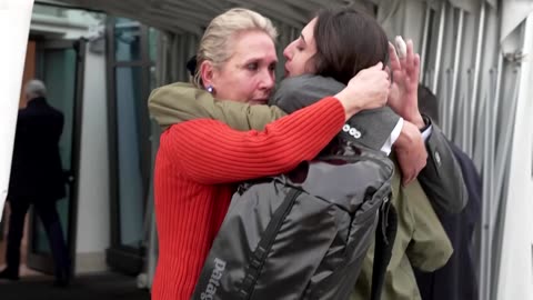 Italian journalist Sala embraces loved ones on her arrival in Rome