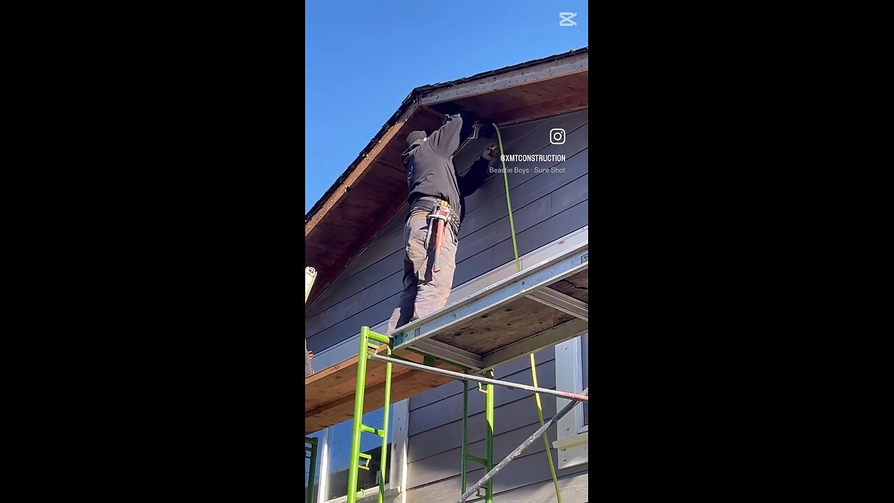 The final piece of Hardie board siding is up