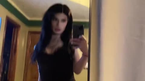 cute goth tgirl seeing herself in the mirror