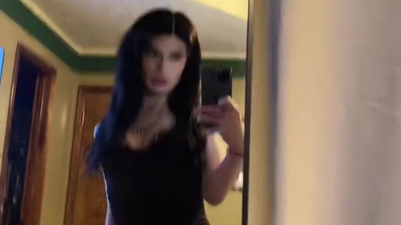 cute goth tgirl seeing herself in the mirror