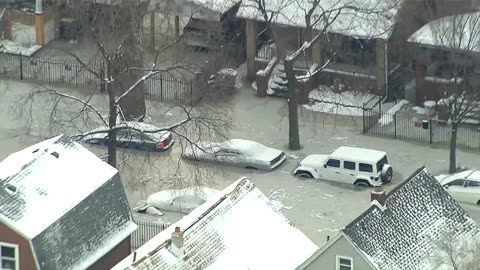 Drone shows flooded Detroit neighborhood freezes over after water main burst