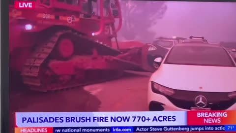 Authorities are using bulldozers to clear abandoned cars from Palisades Drive,