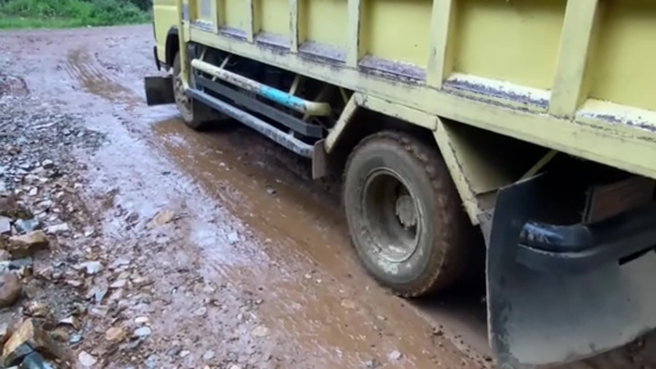 Due to the slippery road, smoke was coming out of the truck's tires