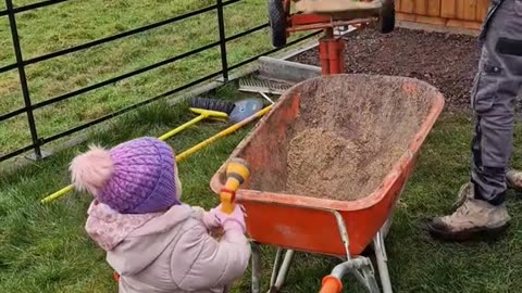 Youngster Helps With Landscaping