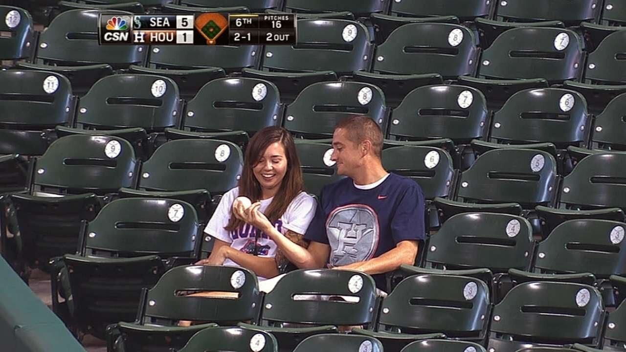 Heroic Catch: A Fan Saves Girlfriend from Foul Ball"