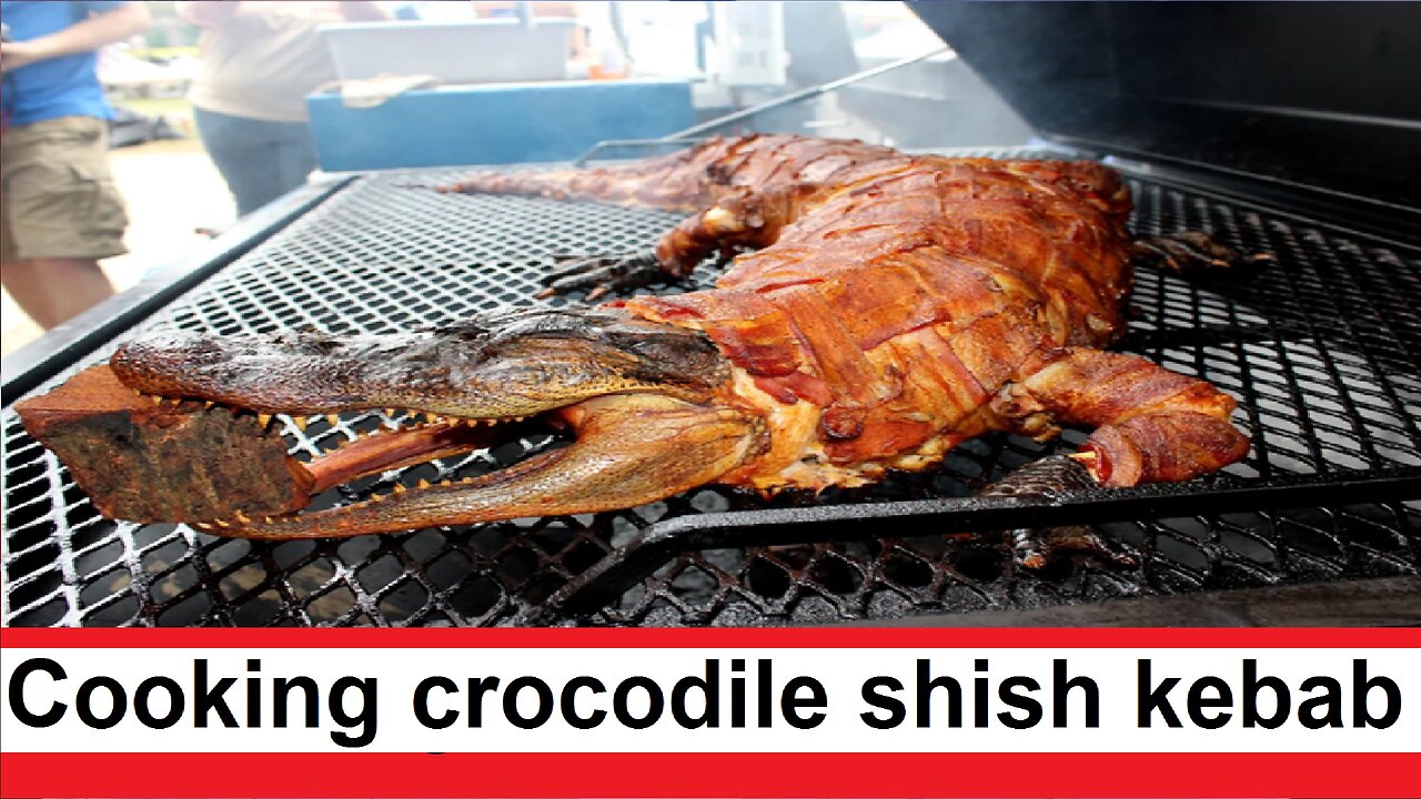 Cooking shish kebab from a 100-kilogram crocodile on a charcoal grill