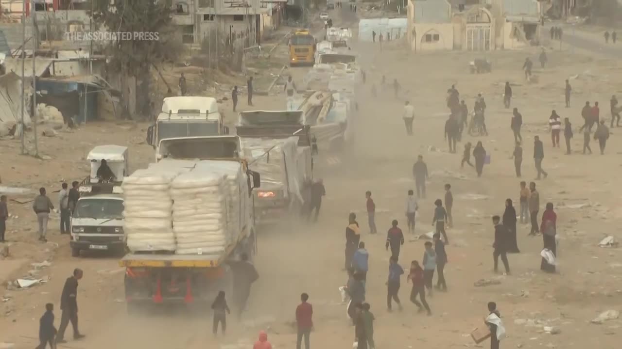 Palestinians in Gaza scramble for aid as trucks drive through Rafah