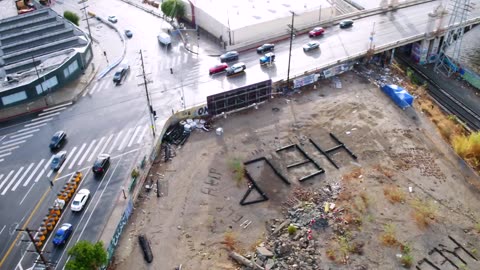 Los Angeles. help written in heavy rail ties. appears to have underground construction