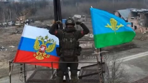 Russian Soldier Raises Flag After Liberating Sudzha