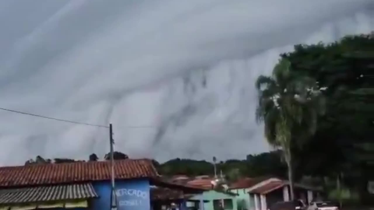 Massive thundercloud engulfs Brazilian towns, creating terrifying visuals.