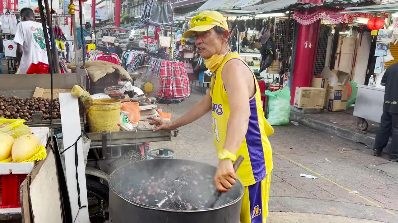 Malaysian man selling japani nut and showcasing KUNG FU Skills