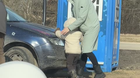 Child Plays With Adult Toy Stuck to Car