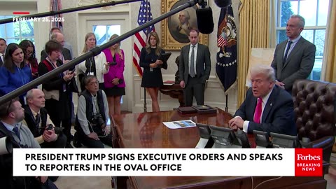 Trump Signs New Executive Orders While Taking Reporters' Questions In The Oval Office