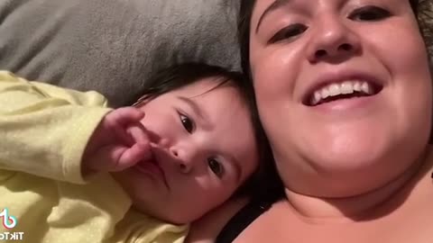 Funny Baby plays with Mummy