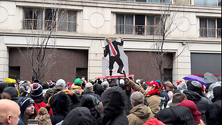 Trump Supporters Pass Cardboard Cutout of Trump Over Crowd Lined Up for Rally in DC