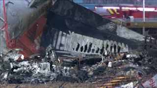 Workers search Jeju Air crash wreckage on the morning after