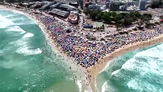 Rio de Janeiro beachgoers cool down during dangerously hot summer