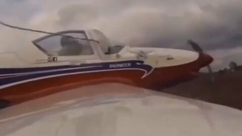 Russian Pilot Nearly Gets Decapitated By A Wire While Flying His Plane Way Too Low