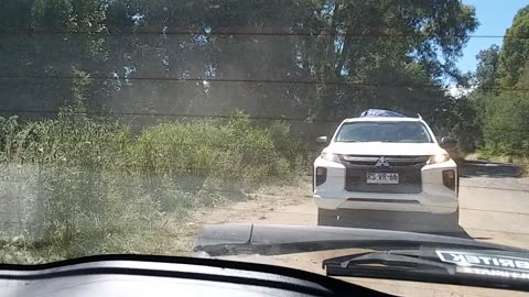 In the first clip a police vehicle has parked across the street after arriving at this pharmacy