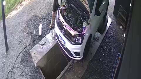 Car Washer Steps Into Water Chute