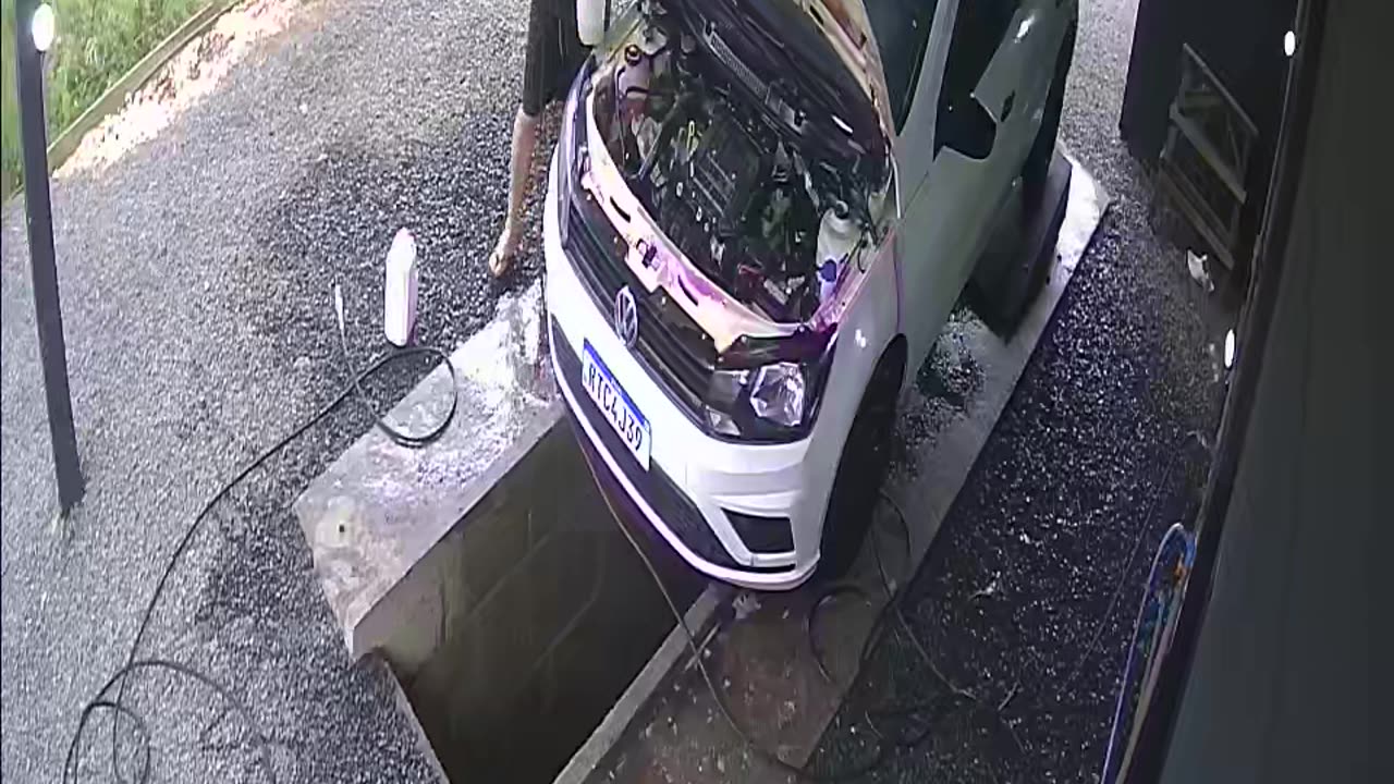 Car Washer Steps Into Water Chute