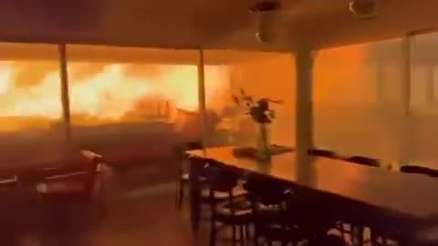 Terrifying footage shows two men and a dog trapped inside a house in California