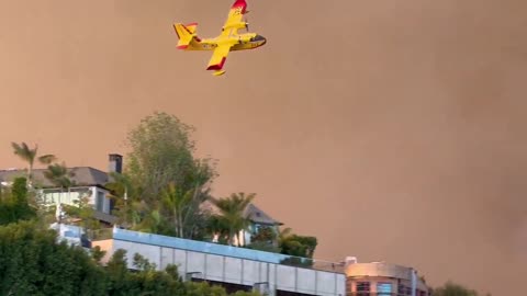 The Hollywood Hills above Sunset Boulevard in Los Angeles are ablaze.