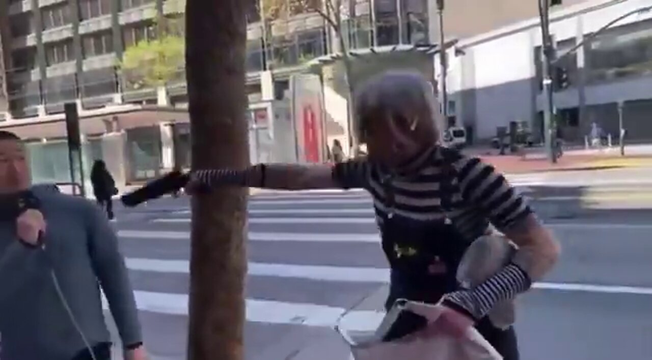 Trans person pulls a gun on a street preacher for saying that God