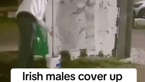 irish men covering up foreign flags