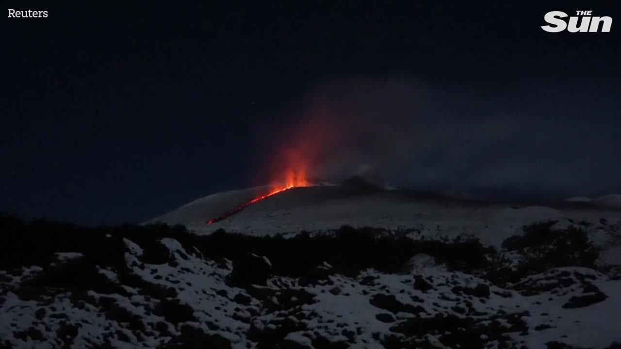 Spectacular scenes as lava erupts from snow-covered Mount Etna