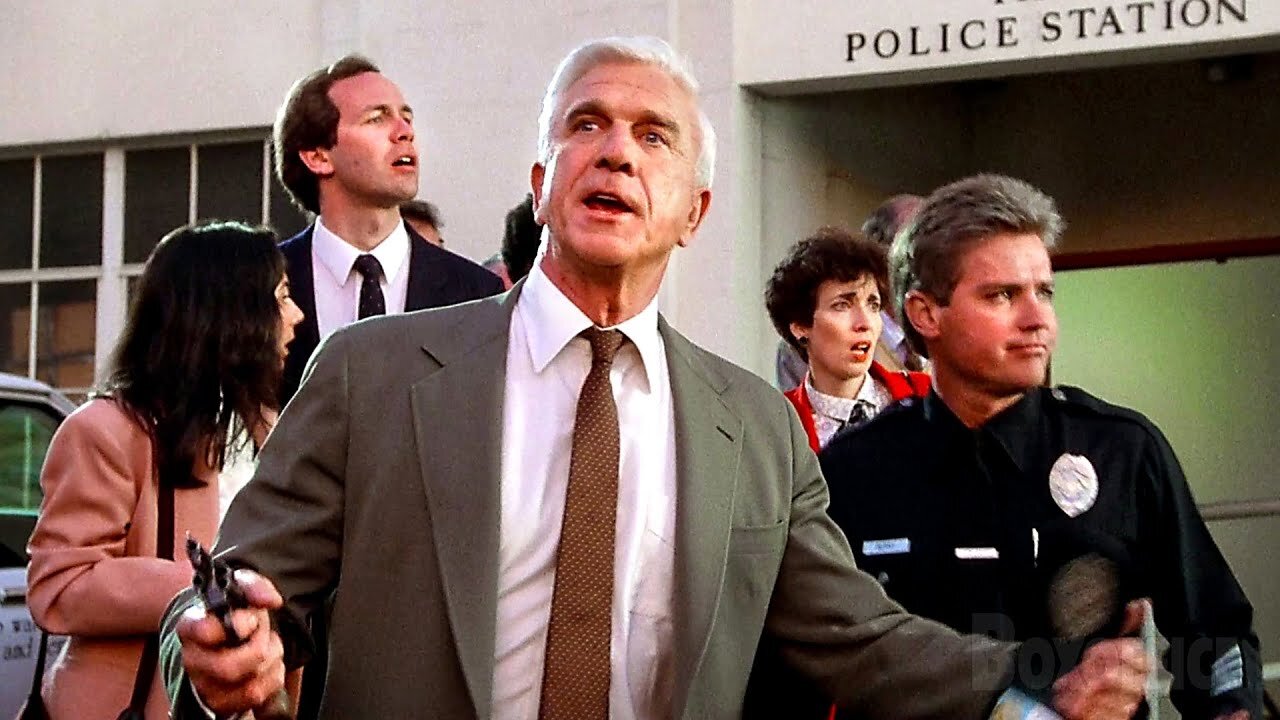 Mistaken Cop Almost Shoots His Own Car! 🚔😂 | The Naked Gun CLIP