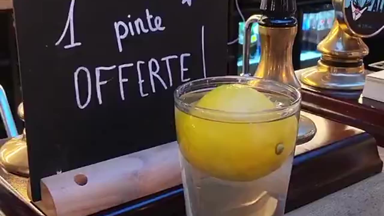A PUB IN FRANCE CHALLENGED CUSTOMERS TO BALANCE A COIN ON A LEMON IN A GLASS OF WATER FOR WINNING A FREE PINT